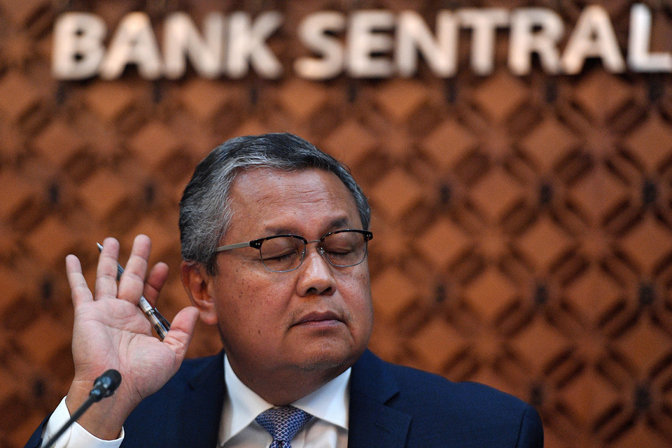 Bank Indonesia Governor Perry Warjiyo listens to a journalist's  question at a press conference in the central bank's headquarter in Jakarta last month. (Antara Photo/Sigid Kurniawan)