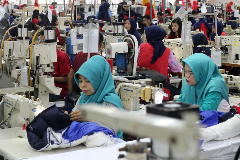 More women are taking up jobs but the a large gender pay gap remains in Indonesia. (Antara Photo/Yulius Satria Wijaya) 