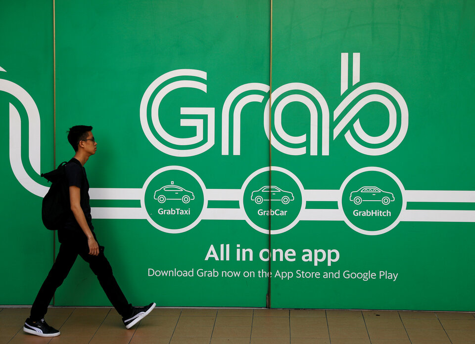 Singapore-based Grab has partnered payments processor Mastercard Inc to issue prepaid cards tailored to Southeast Asian consumers, extending the use of Grab's digital wallet and helping its unbanked users transact online. (Reuters Photo/Edgar Su)