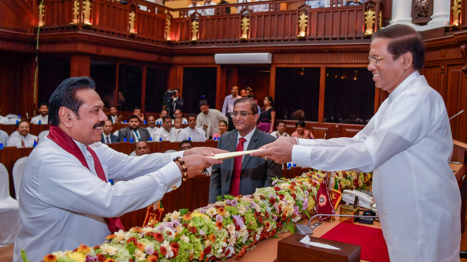Sri Lanka's newly appointed Prime Minister Mahinda Rajapaksa (left) being sworn in as the Minister of Finance and Economic Affairs before President Maithripala Sirisena in Colombo, Sri Lanka, on Oct 29, 2018. (Reuters Photo/Al Drago)