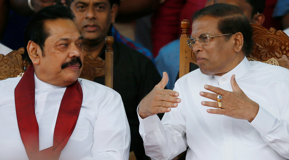 Sri Lanka's newly appointed Prime Minister Mahinda Rajapaksa and President Maithripala Sirisena talk during a rally near the parliament in Colombo, Sri Lanka on Monday. (Reuters Photo/Dinuka Liyanawatte)