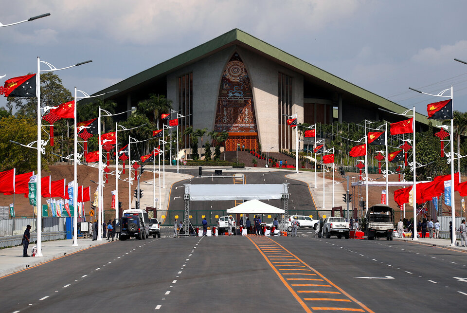 Chinese and Papua New Guinea national flags are seen lining a street in front of the parliament building in central Port Moresby, the capital city of the poorest nation in the 21-member Asia Pacific Economic Cooperation (APEC) group, in Papua New Guinea on Thursday. (Reuters Photo/David Gray)