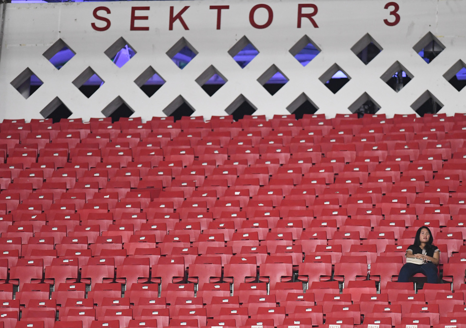 Rows of empty seats can be seen during the 2018 Asean Football Federation Cup match between Indonesia and Timor Leste at Bung Karno Main Stadium in Jakarta on Tuesday.  Supporters are boycotting matches of the national team over dissatisfaction with the management of the Indonesian Football Association (PSSI). (Antara Photo/Akbar Nugroho Gumay)