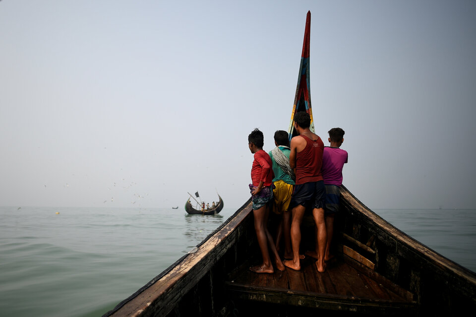 Rohingya refugees seen on a fishing boat in the Bay of Bengal near Cox's Bazaar in Bangladesh in this March 2018 file photo. (Reuters Photo/Clodagh Kilcoyne)  