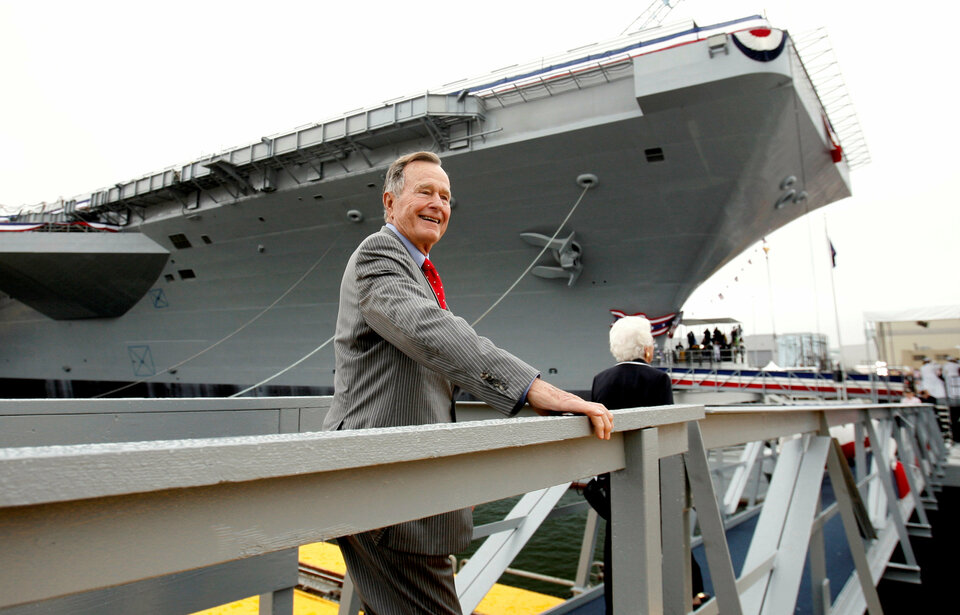 Former President George H.W. Bush walks the gangway as he arrives for the christening ceremony of the USS George H.W. Bush at Northrop-Grumman's shipyard in Newport News, Virginia October 7, 2006. (Reuters Photo/Kevin Lamarque)