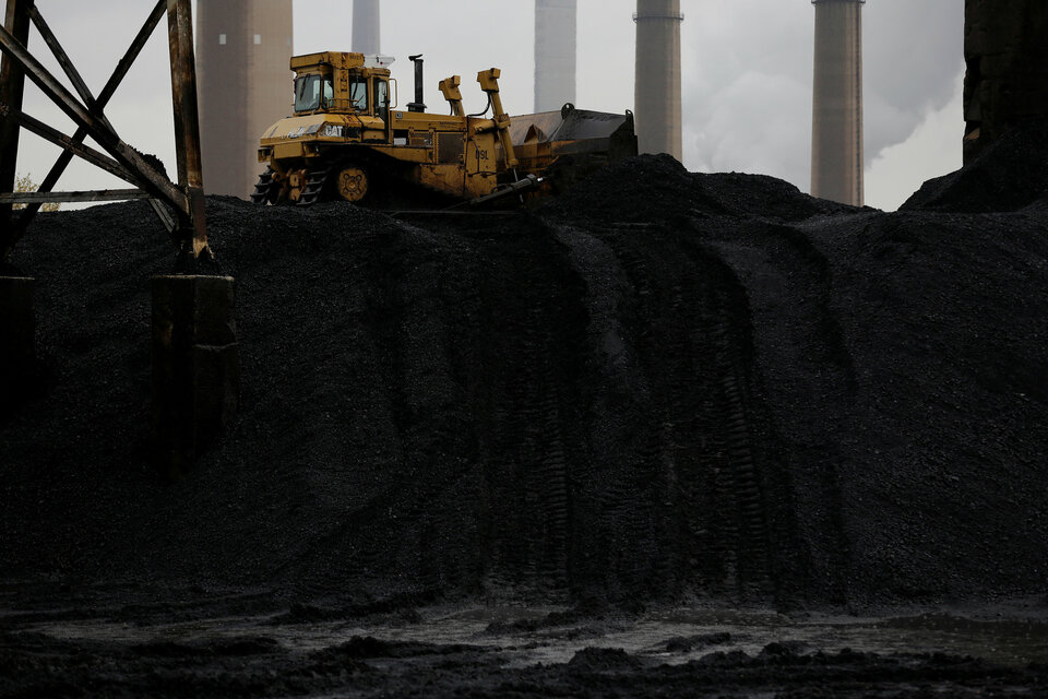 A bulldozer moves coal at the Murray Energy Corporation port facility in Powhatan Point, Ohio, in this November 2017 file photo. (Reuters Photo/Joshua Roberts)