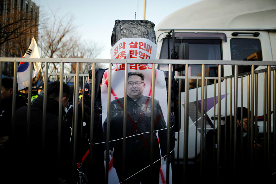 A banner with the image of North Korean leader Kim Jong-un is seen as members of a South Korean conservative civic group take part in an anti-North Korea protest in Seoul on Dec. 8, 2018. (Reuters Photo/Kim Hong-ji)