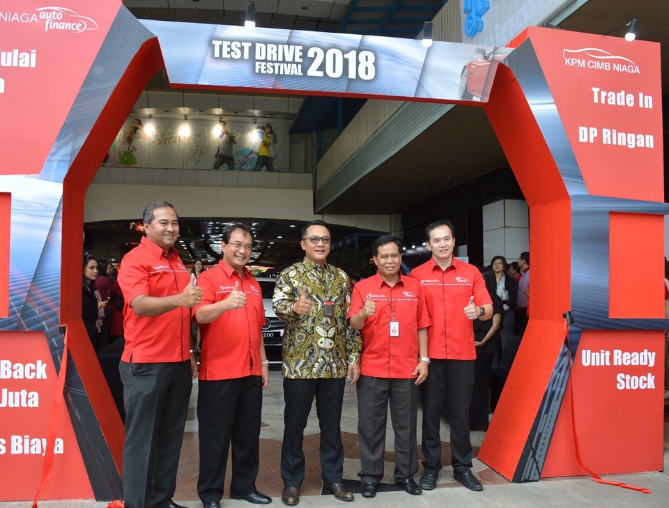 Ristiawan Suherman, president director of CIMB Niaga Auto Finance posing for a photo at the company's first car exhibition in South Jakarta on Monday. (Photo courtesy of CNAF)