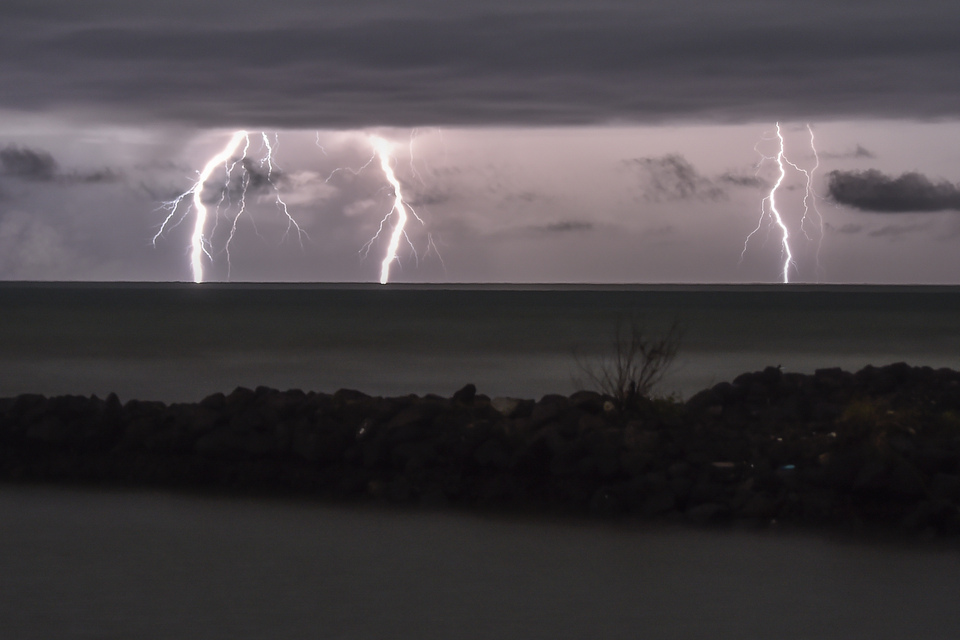 Thunder and lightning are seen around Anak Krakatau volcano in Merak, Banten, in 2018. The Meteorology, Climatology, and Geophysics Agency (BMKG) has issued a warning for potential extreme weather in several regions of Indonesia over the next three days due to Tropical Cyclone 91S, detected in the Indian Ocean southwest of Banten on Saturday, Dec. 9, 2024. (Antara Photo/Muhammad Adimaja)