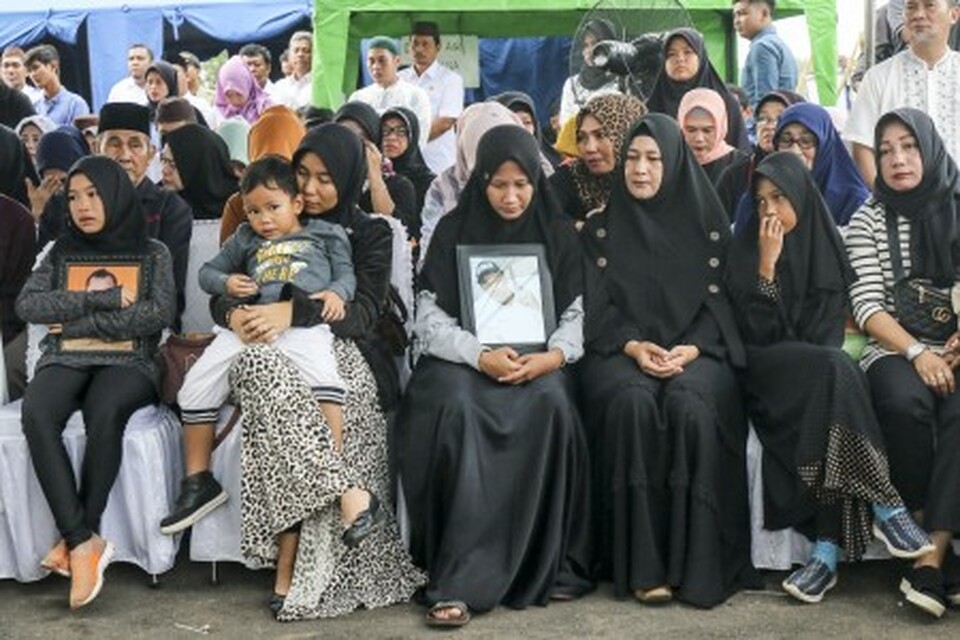 Families of some of the 189 people killed in a Lion Air plane crash plan a protest rally in Indonesia on Thursday, while stalled efforts to bring the main wreckage to the surface and find the second black box are set to resume next week. (Antara Photo/Ananta Kala)