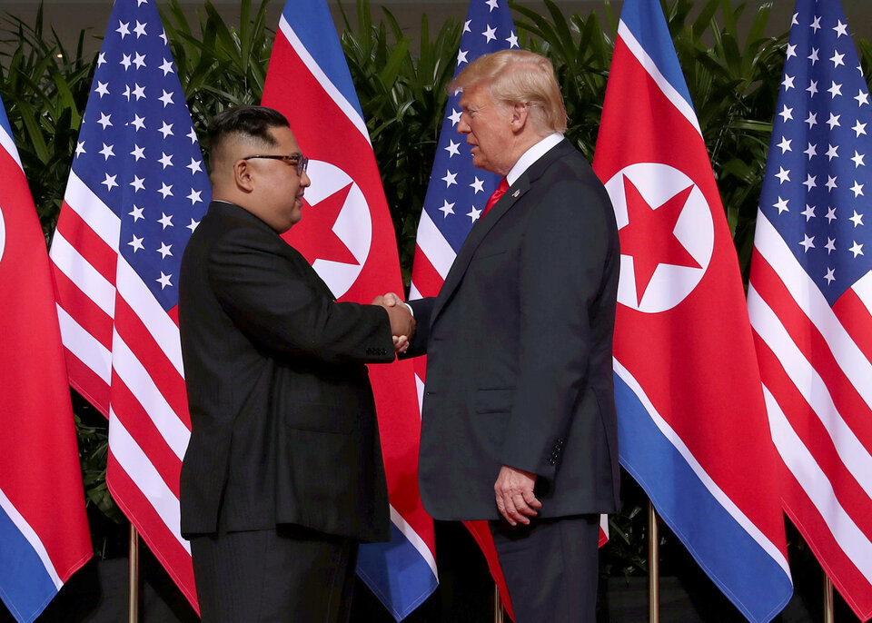 US President Donald Trump shakes hands with North Korean leader Kim Jong-un at the Capella Hotel on Sentosa island in Singapore June 12, 2018.  (Reuters Photo/Jonathan Ernst)