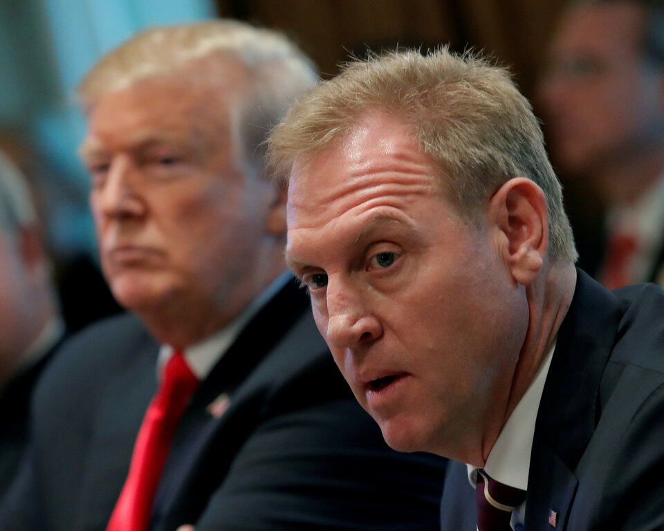 US President Donald Trump (L) listens next to Acting US Defense Secretary Patrick Shanahan during a Cabinet meeting on day 12 of the partial US government shutdown at the White House in Washington, US, Jan. 2, 2019.  (Reuters Photo/Jim Young)