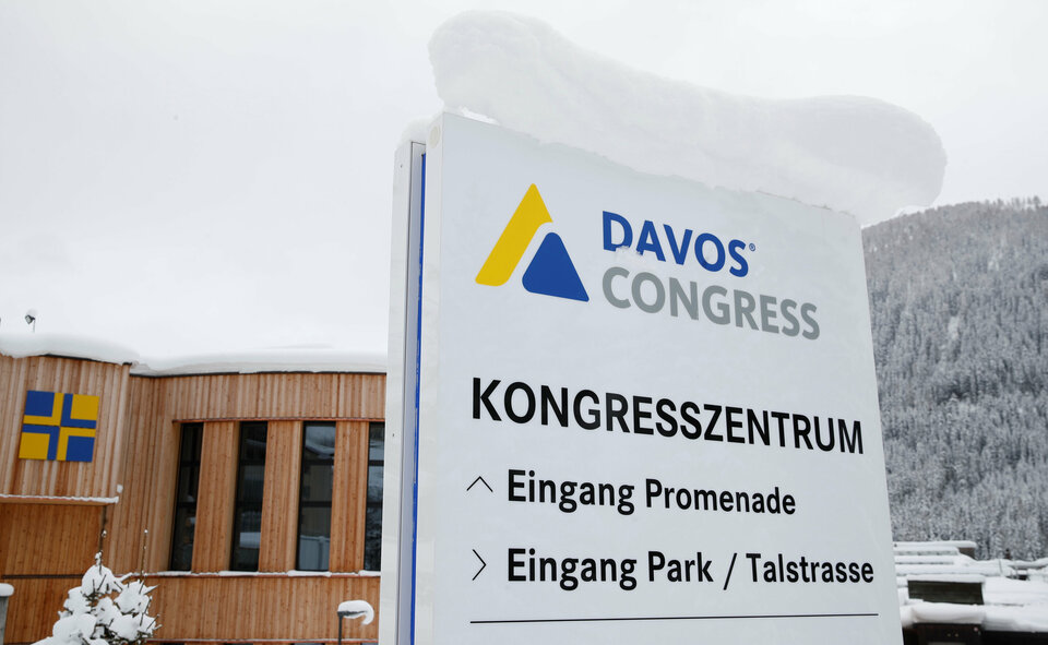 A snow-covered sign seen in front of the congress center, the venue of the World Economic Forum in Davos, Switzerland, on Jan. 12, 2019. (Reuters Photo/Arnd Wiegmann)