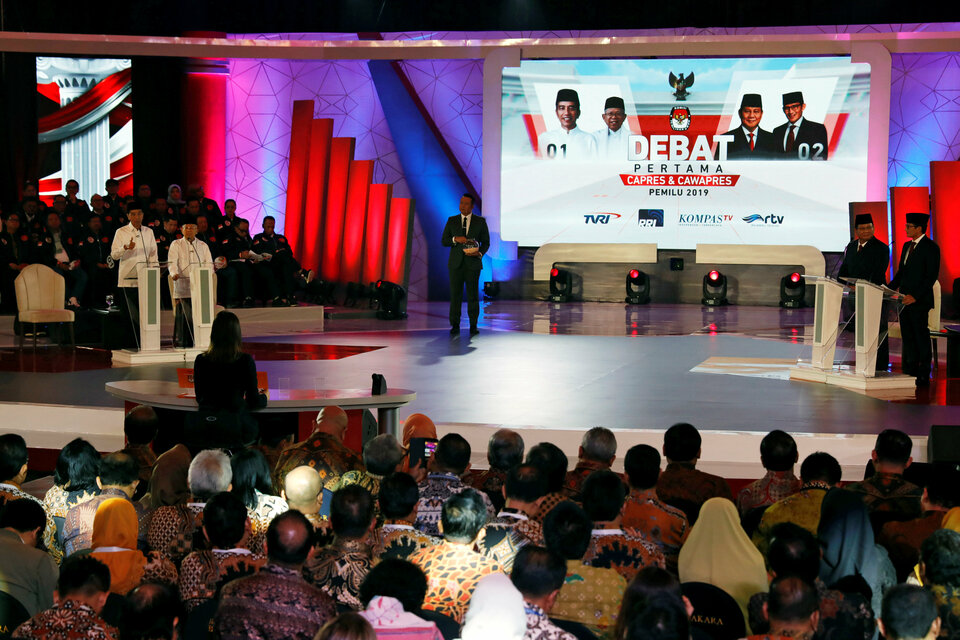 Presidential candidate Joko 'Jokowi' Widodo and his running mate Ma'ruf Amin seen on the left side of the stage during a televised debate with their opponents, Prabowo Subianto and his running mate Sandiaga Uno on the opposite side, in Jakarta on Thursday. (Reuters Photo/Willy Kurniawan)