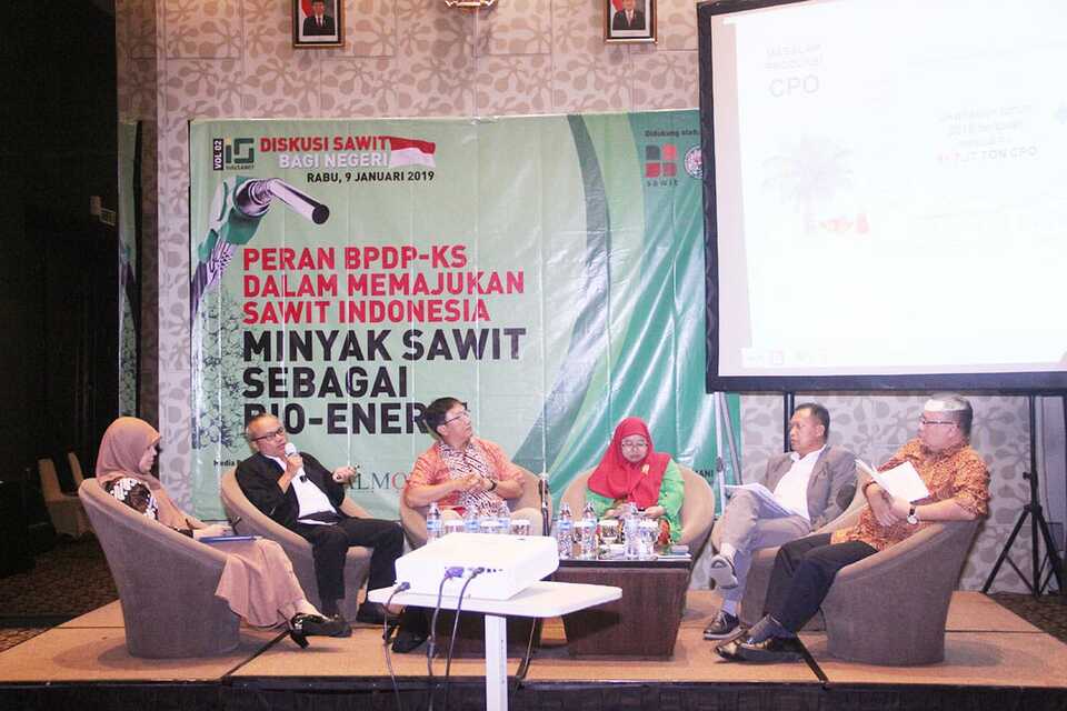 Five speakers during the panel discussion titled '