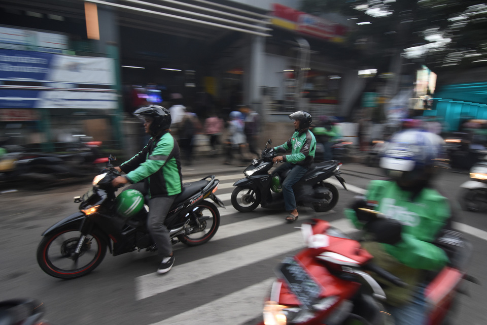 Driver-partners of GrabBike saw their income up by 113 to 114 percent to an average of Rp 4 million to Rp 7 million per month after joining Grab. (Antara Photo/Indrianto Eko Suwarso)