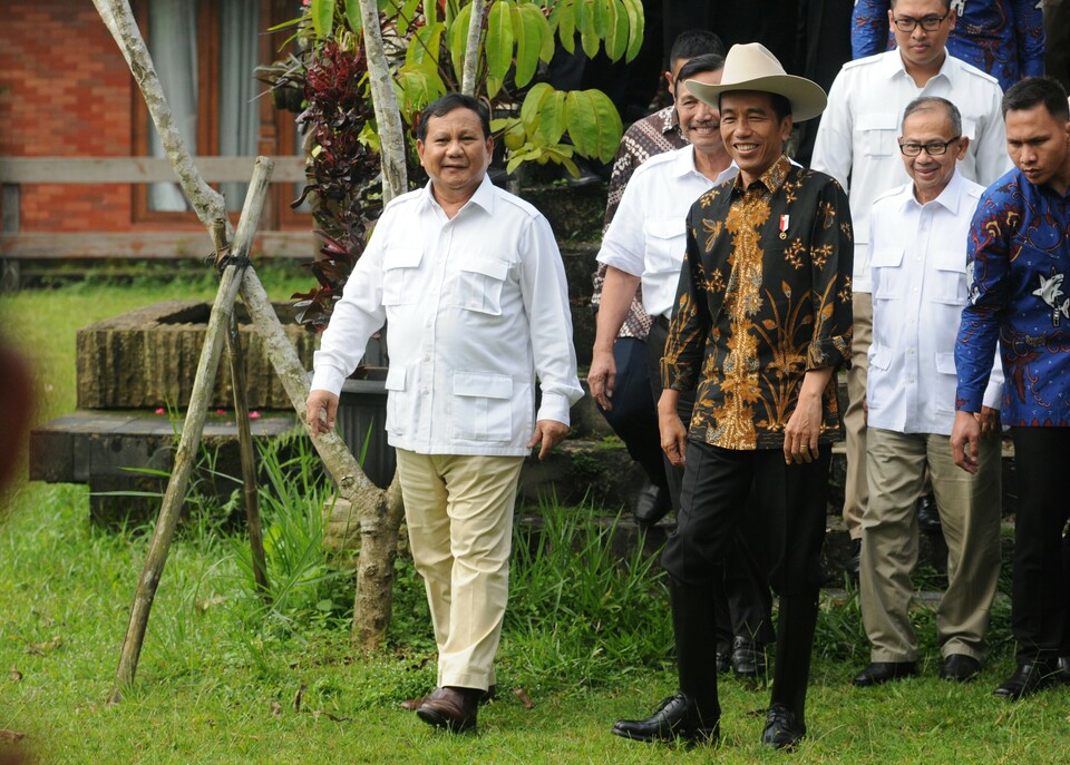 Prabowo Subianto, left, and Joko Widodo sharing a laugh at the former's residence in Hambalang, Bogor, West Java, back in 2016. (Photo courtesy of the Cabinet Secretariat)