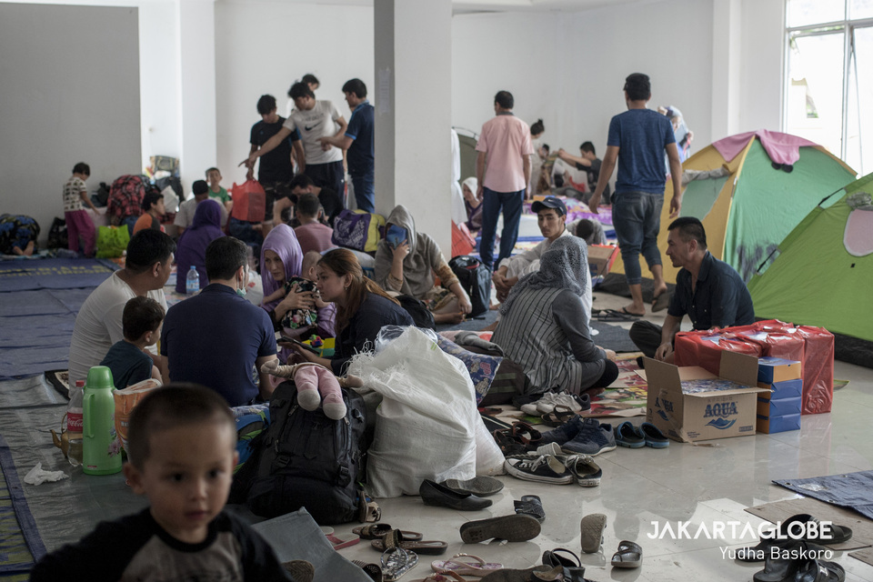 Asylum seekers and refugees forced to sleep on mats in a shelter in Kalideres, West Jakarta, in July last year. (JG Photo/Yudha Baskoro)