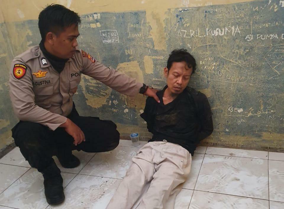 A photo provided by police shows the suspect, right, after the attack on Chief Security Minister Wiranto in Pandeglang, Banten, on Thursday. He has been identified as Syahril Alamsyah, alias Abu Rara, 31. (B1 Photo)