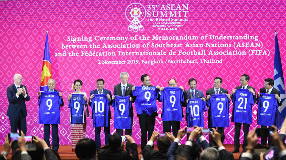 Asean leaders hold their blue jerseys during the signing of an MoU with FIFA in Bangkok on Saturday. (Photo courtesy of FIFA)