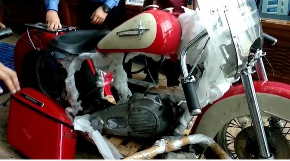 The disassembled parts of a smuggled Harley Davidson Shovelhead are shown by customs officials in Jakarta on Thursday. (B1 TV Photo)