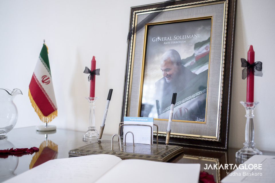 A photo of Qassem Suleimani, Iran's most powerful general who was assassinated by a drone strike ordered by Donald Trump last week, was on display along with a book of condolences at the Embassy of the Islamic Republic of Iran in Menteng, Central Jakarta, on Tuesday (07/01). (JG Photo/Yudha Baskoro)