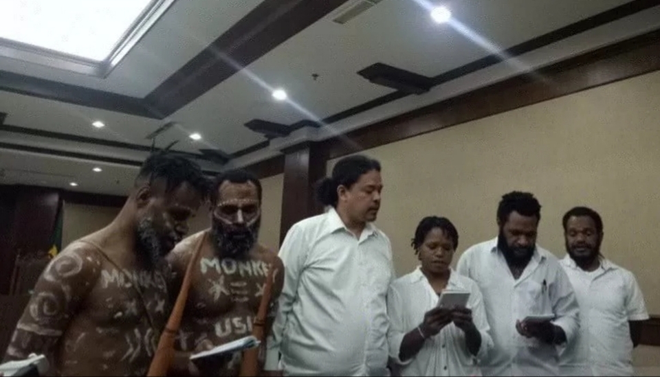 Ambrosius Mulait and Dano Anes Tabuni, first and second on the left, wore a 'koteka,' or traditional Papuan penis sheaths, at their treason trial in the Central Jakarta District Court on Monday. (Antara Photo/Livia Kristianti)
