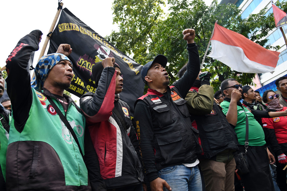 Grab Indonesia and Gojek Indonesia drivers went on a series of strikes from the beginning of this month to demand fare raises. (Antara Photo/Aditya Pradana Putra)