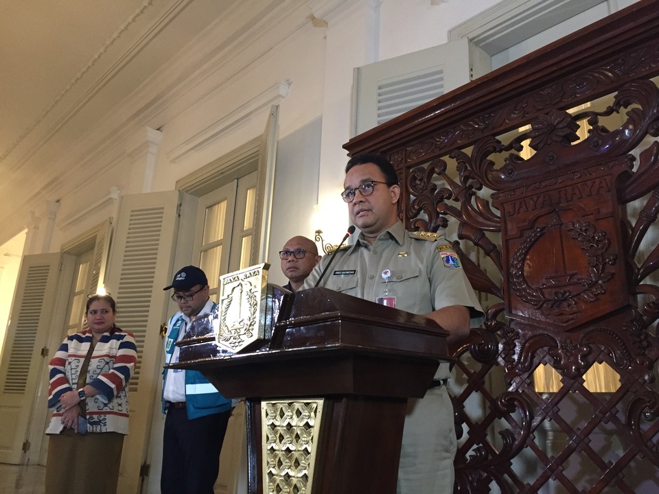 Jakarta Governor Anies Baswedan announces the city's public transportation will return to normal during a press conference at City Hall on Monday. (JG Photo/Tara Marchelin)