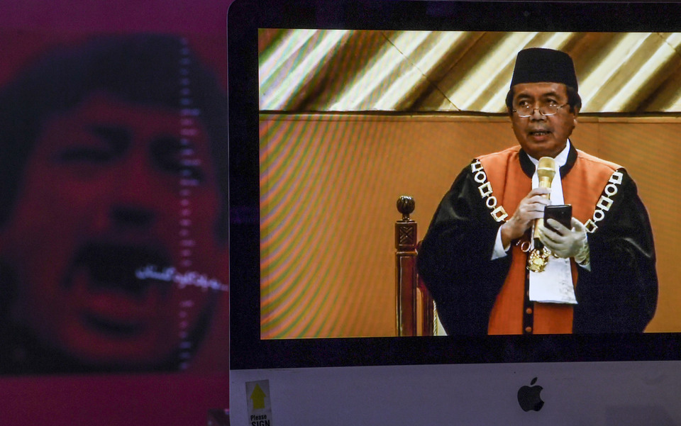 Chief Justice Muhammad Syarifuddin is seen in a video streaming at the Supreme Court building. (Antara Photo/Hafidz Mubarak)