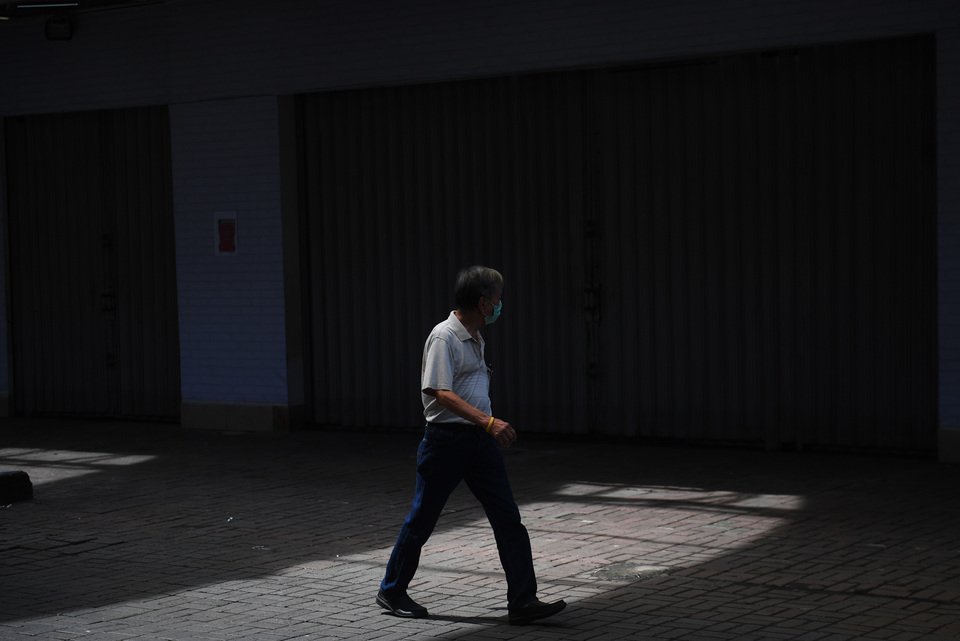 A man walks in Pasar Baru market in Jakarta where stores are closed due to the Covid-19 outbreak on April 1. (Antara Photo/Akbar Nugroho Gumay)