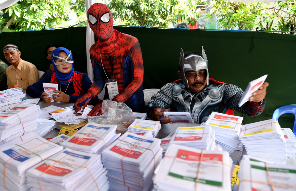 Election officials wearing superhero costumes at a polling station in Surabaya, East Java, last year. (Antara Photo/Zabur Karuru)