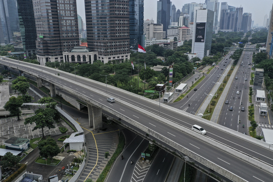 Aerial photo shows quiet Jakarta roads during social restrictions due to the Covid-19 outbreak. (Antara Photo/Hafidz Mubarak A)