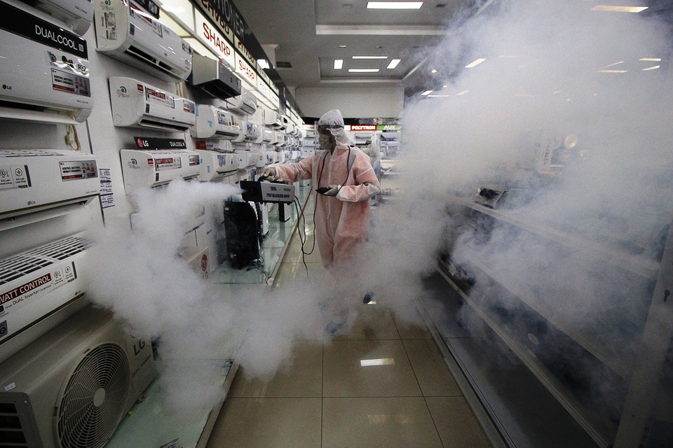 A worker sprays water-based disinfectant at an electronic shop in Surabaya, East Java on June 16, 2020. East Java is the worst-hit province of the Covid-19 outbreak in Indonesia. (Antara Photo/Moch Asim)