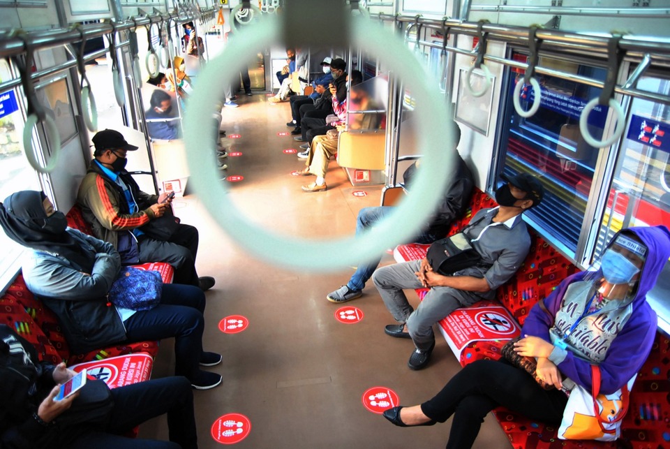 Passengers sitting in a commuter line train in Bogor Station. (Antara Photo/Arif Firmansyah)