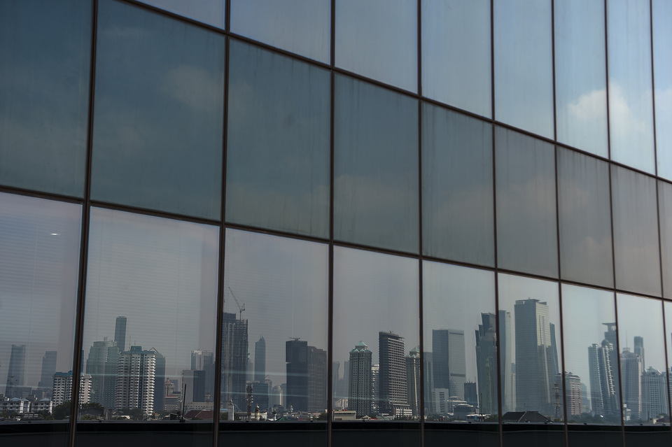 This 2020 file photo shows reflections of high-rise buildings in Jakarta. (Antara Photo/Nova Wahyudi)
