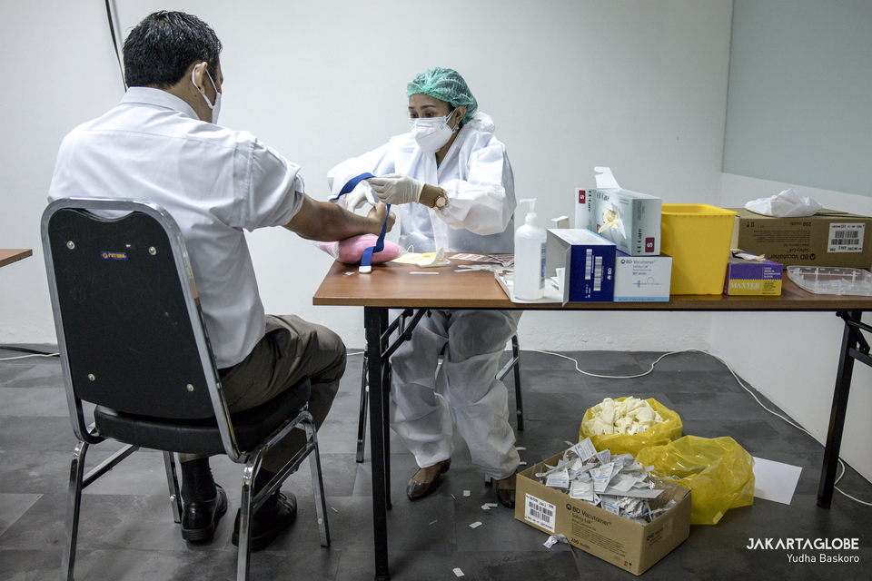 Covid-19 diagnostic testing is conducted at a business premise in South Jakarta on July 30, 2020.  (JG Photo/Yudha Baskoro)