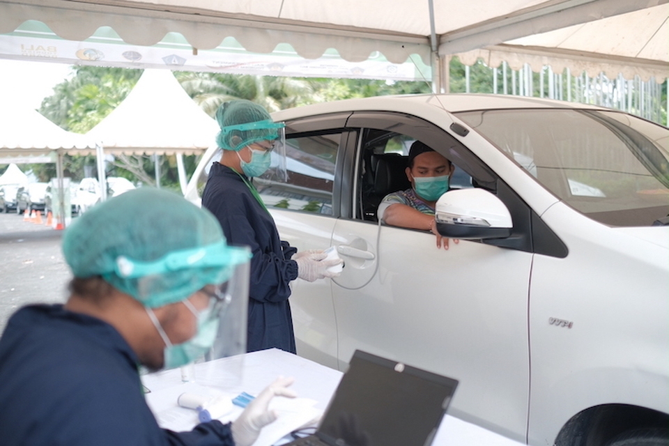 Grab's Covid-19 vaccination drive-thru at Bali Nusa Dua Convention Center (BNDCC) in Badung, Bali. (Photo Courtesy of Grab)	