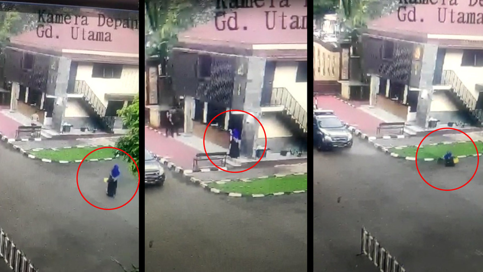 A person in female dress and niqab is shot to death after pointing a gun at the National Police headquarters in South Jakarta on March 31, 2021. (Videography)