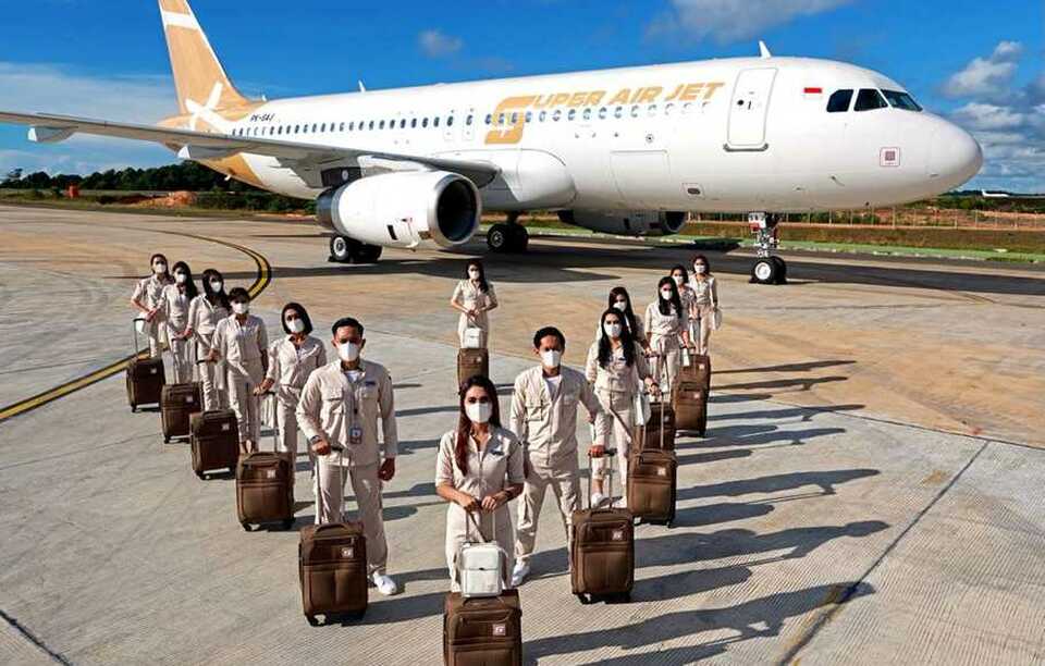 A handout photo shows the new Indonesian budget airline Super Air Jet's livery and air crew members in the airline's uniform. (Photo courtesy of Super Air Jet)