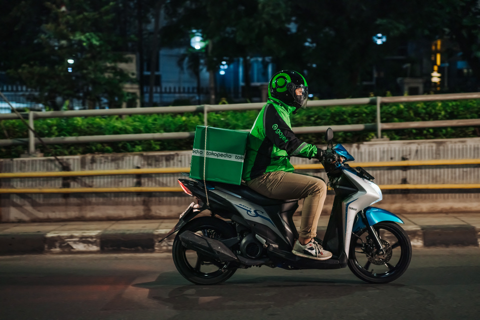 This undated photo shows a Gojek's driver-partner delivering a Tokopedia parcel in Jakarta. (Photo courtesy of Gojek)