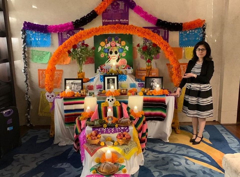 Lizett Aceves, cultural attaché at the Mexican Embassy in Indonesia, stands next to an ofrenda or home altar during the Day of the Dead celebrations at Hotel Raffles Jakarta in 2019. (Photo Courtesy of Lizett Aceves)