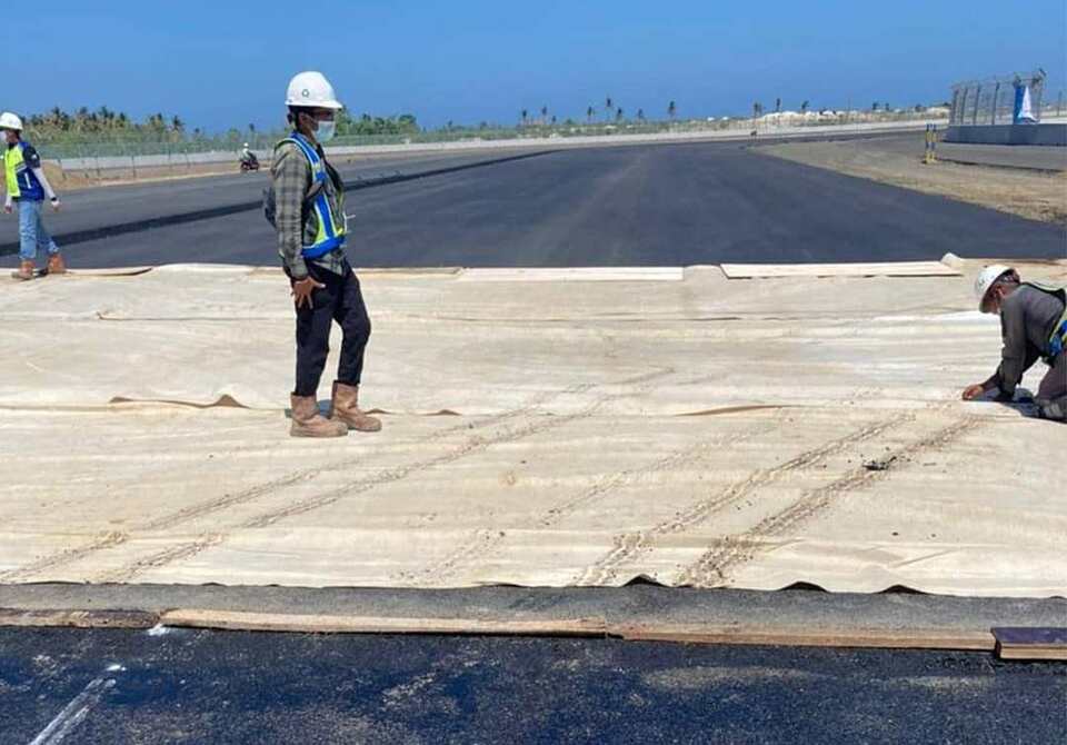 Workers complete the work to pave Mandalika Circuit racetrack in Lombok, West Nusa Tenggara, on August 14, 2021. (Photo courtesy of Mandalika Grand Prix Association)