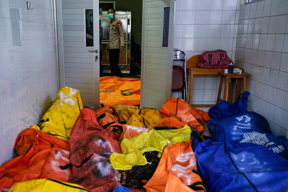 Body bags containing the victims of the Tangerang prison fire are seen at the Tangerang Municipal Hospital on Sept. 8, 2021. (Ruht Semiono)