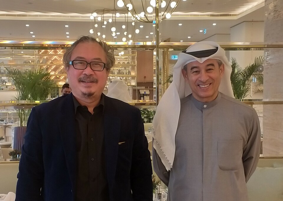 Mohamed Ali Alabbar, founder and chairman of Emaar Properties Group, right, and Rusmin Lawin, REI's deputy chairman for foreign relations, pose for a picture when they meet in Dubai, on Jan 12, 2022. (Photo courtesy of REI)