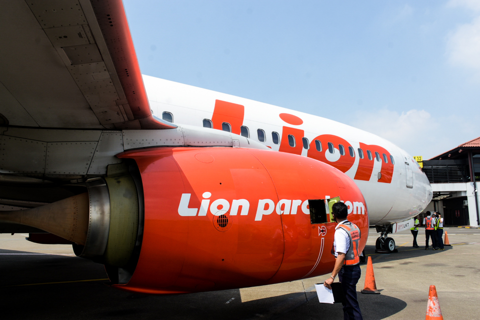 This undated photo shows a member of Lion Mentari Airlines' ground crew inspecting the aircraft engine before a flight. (Photo courtesy of Lion Air)