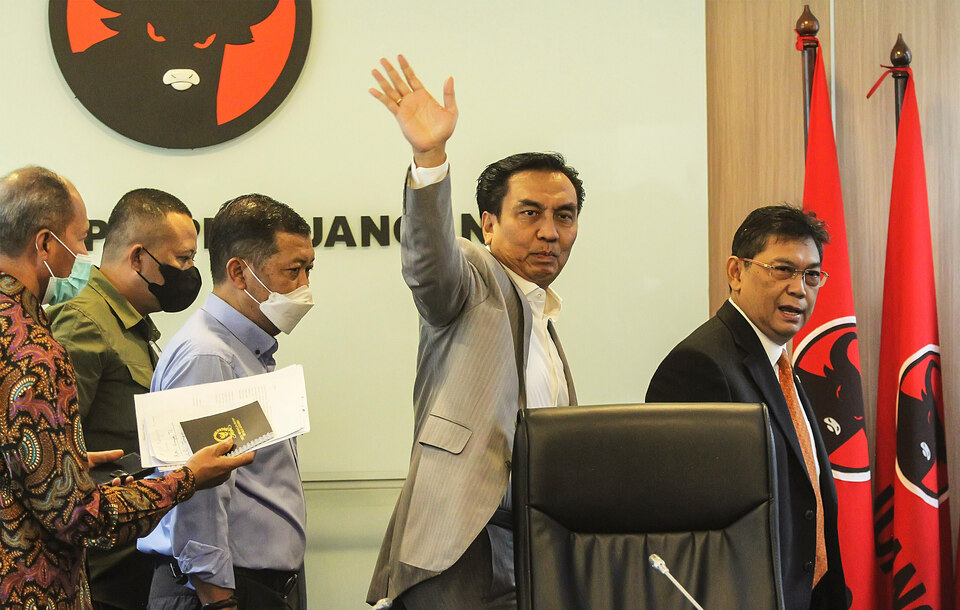 House of Representatives member Effendi Simbolon, second right, waves at journalists after a press conference at the legislature building in Jakarta on Sept. 14, 2022. (Beritasatu Photo/Ruht Semiono)