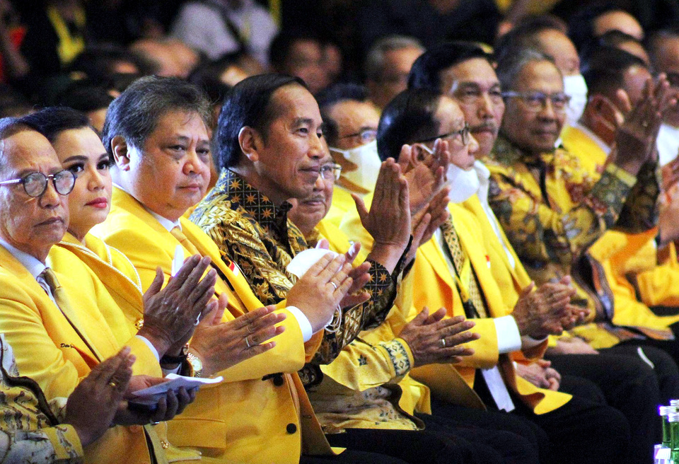 President Joko Widodo, fourth left, sits next to Golkar Party Chairman Airlangga Hartarto during an event to celebrate the 58th anniversary of the Golkar Party at Jakarta International Expo on October 21, 2022. (Joanito De Saojoao)