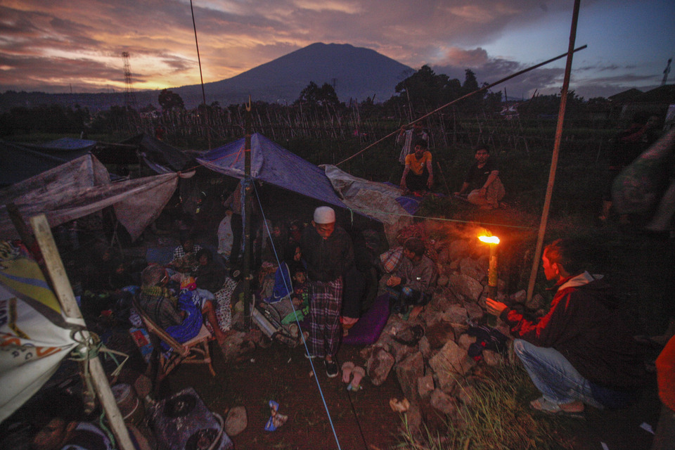 Villagers in Cianjur, the epicenter of the November 21, 2022 earthquake in western Java, set up a makeshift shelter near paddy fields for fear of aftershocks. (Antara photo/Yulius Satria Wijaya)