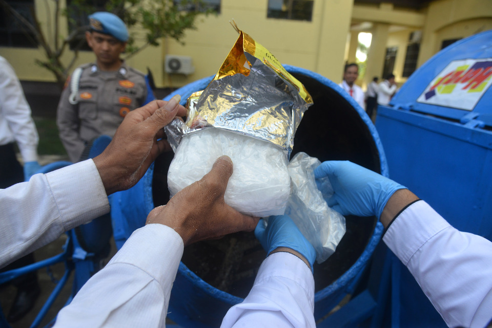 File photo: Law enforcement officials destroy packs of methamphetamine from the evidence locker in Banda Aceh on December 23, 2022. (Antara photo)